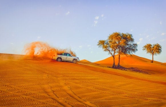 Riding the sand dunes in the Arabian Desert