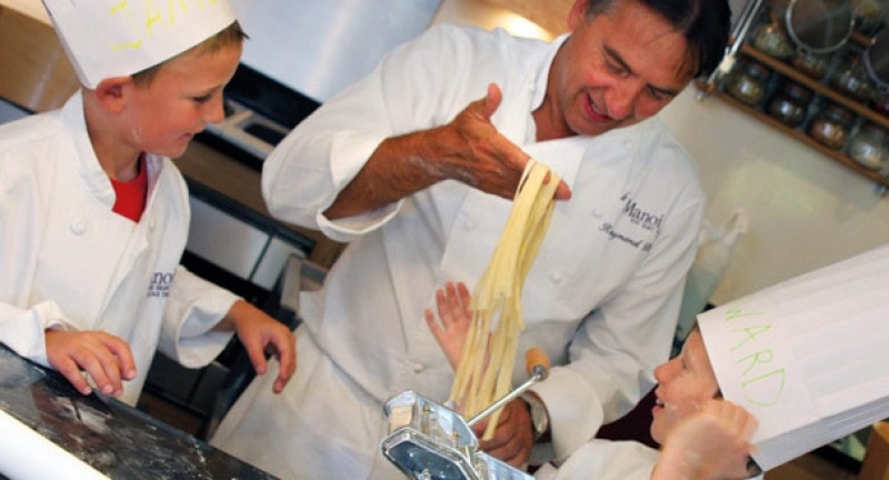 Chef showing kids pasta