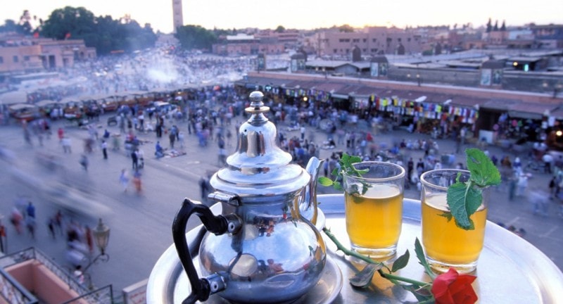 tea pot with crowd in background marrakech morocco