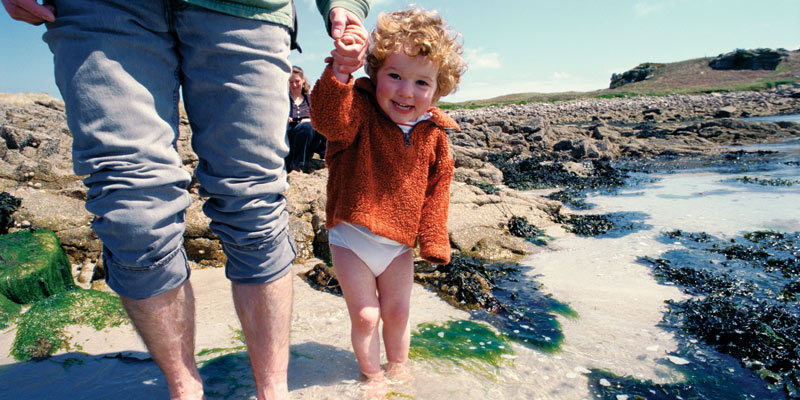 father-and-young-son-paddling-on-isle-of-wight