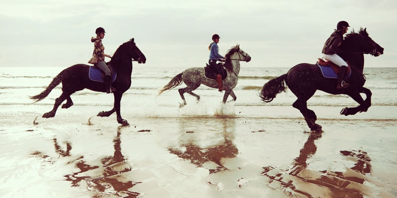 Horseriding on the beach in Wales