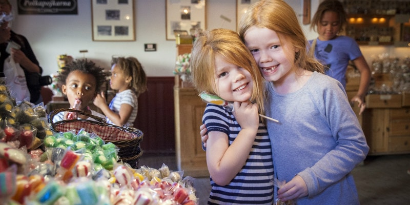 two girls in sweet shop