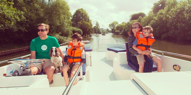 family-with-lifejackets-on-a-boat