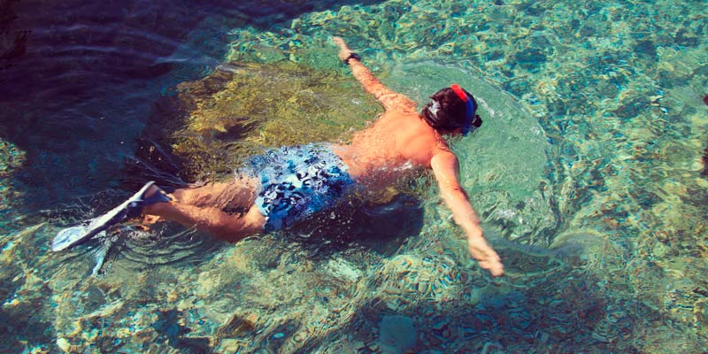 man-snorkelling-in-clear-waters