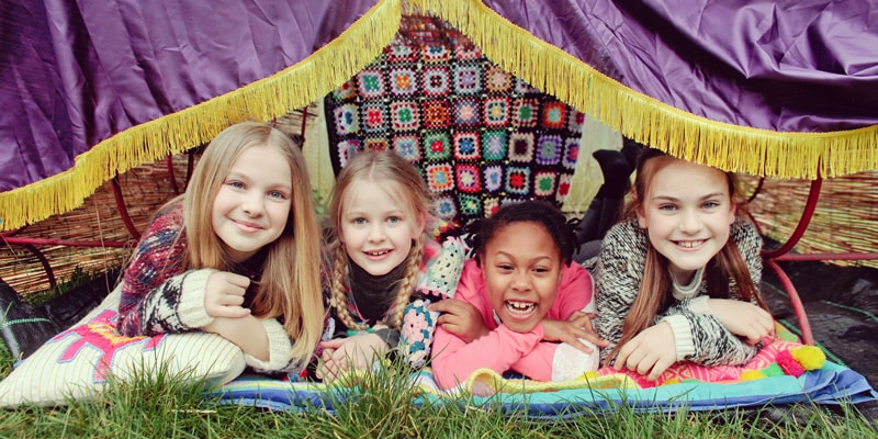 DEN-DAY children in a home made den