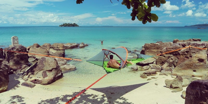 man-in-tentsile-tent-in-Cambodia