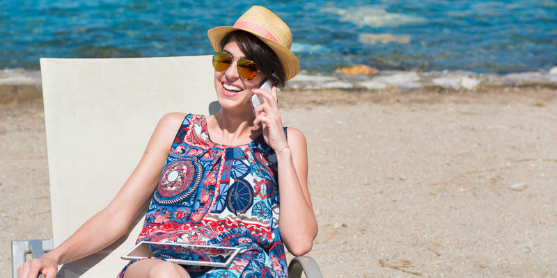 woman-on-mobile-phone-on-beach