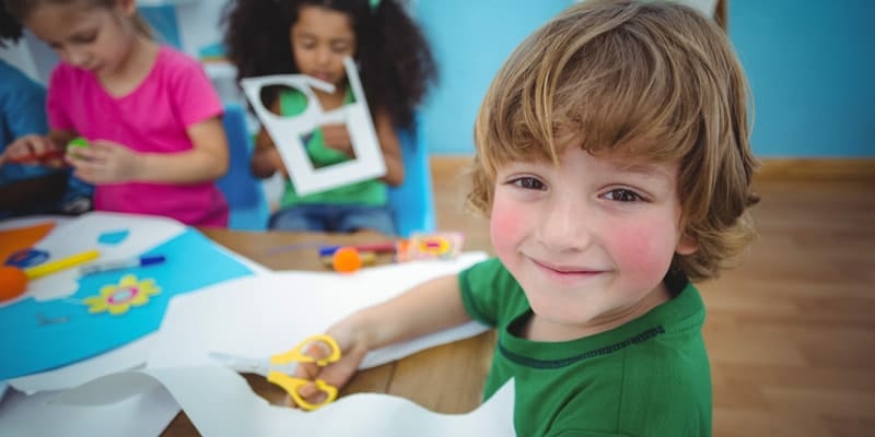 small children crafting at table