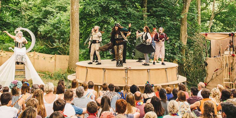 performers-in-a-play-in-wood-at-wilderness-festival