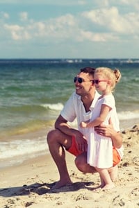 dad-and-young-daughter-on-beach