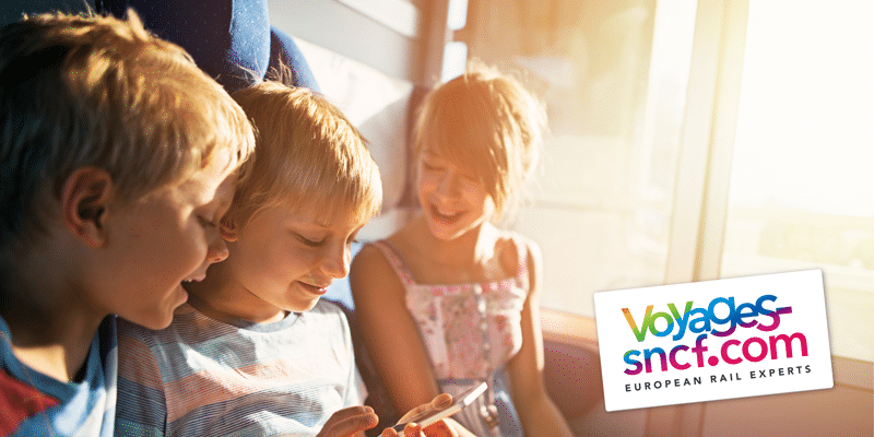 1.-Main-image-Children-with-phone-on-train 2