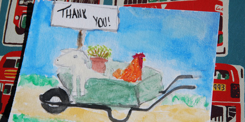 A watercolour painting of a hen in a wheelbarrow as a thankyou note