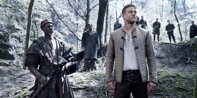Charlie Hunnam as King Arthur and his men in the Forest of Dean