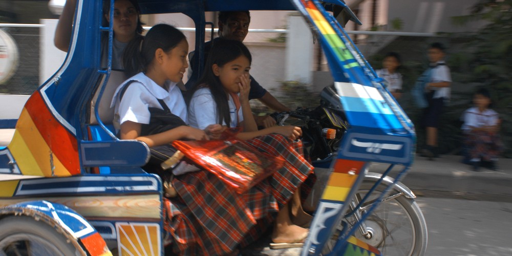 schoolgirls-in-tricycle-taxi-borocay-island-the-philippines-2023
