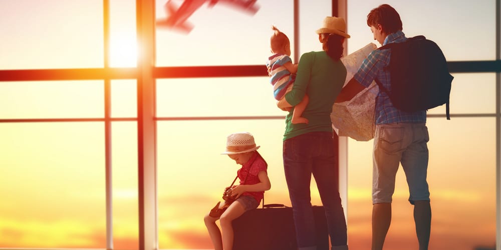 family at the airport - tips for your first holiday with a baby
