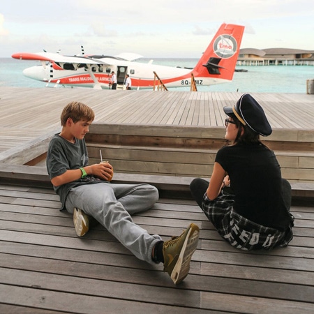 Children in front of seaplane Maldives
