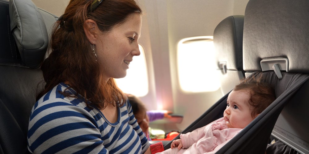 baby on a plane - tips for your first holiday with a baby