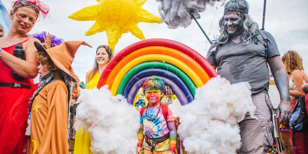 boy in rainbow costume - family-friendly festivals in 2018