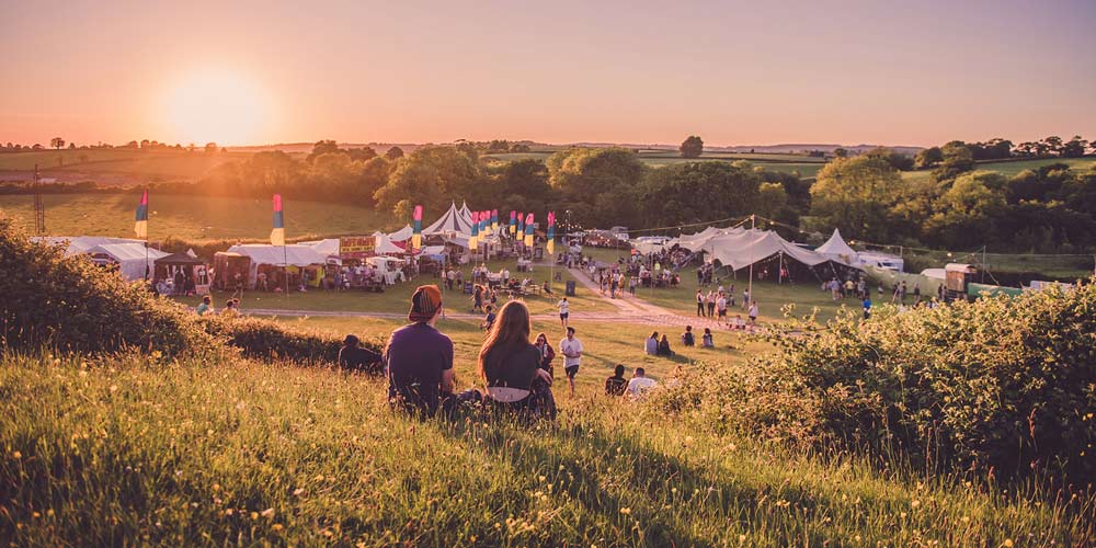 festival couple on hill - family-friendly festivals in 2018