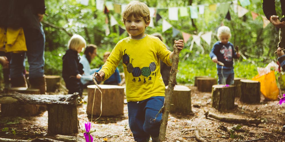 boy in the woods - family-friendly festivals in 2018