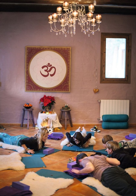 family practicing yoga in studio off-season ibiza