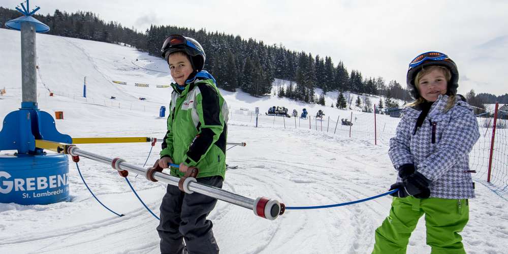 Family holiday in Austria, children skiing