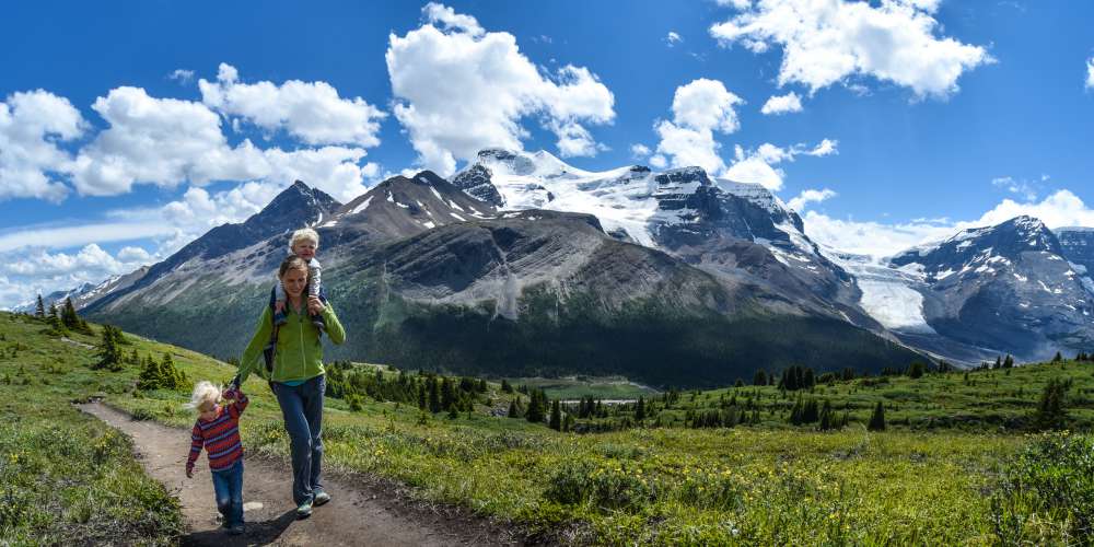 best family holiday destinations for 2019, Mother and children walking in Jasper National Park, Canada
