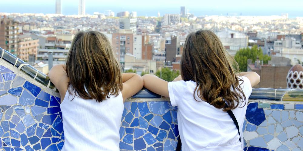 Best family destinations in Spain, children look out over Barcelona from Park Guell