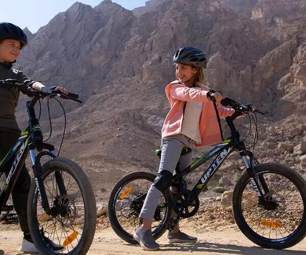 children-mountain-biking-jebel-hafit-desert-park-al-ain-uae