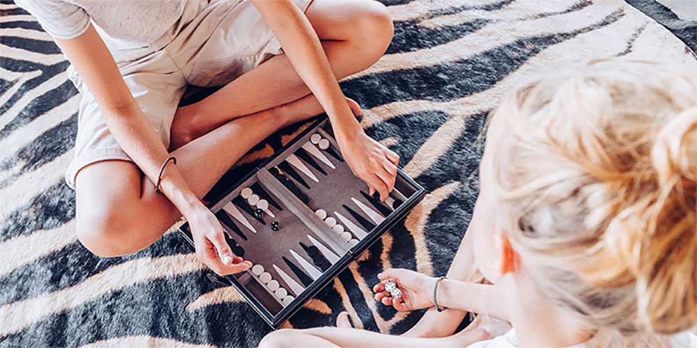 Original Travel luxury family holidays mother and son playing backgammon