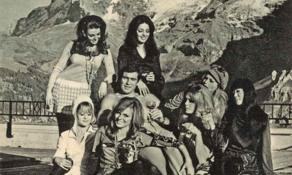 George Lazenby as James Bond in Mürren with Bond girls in 1967