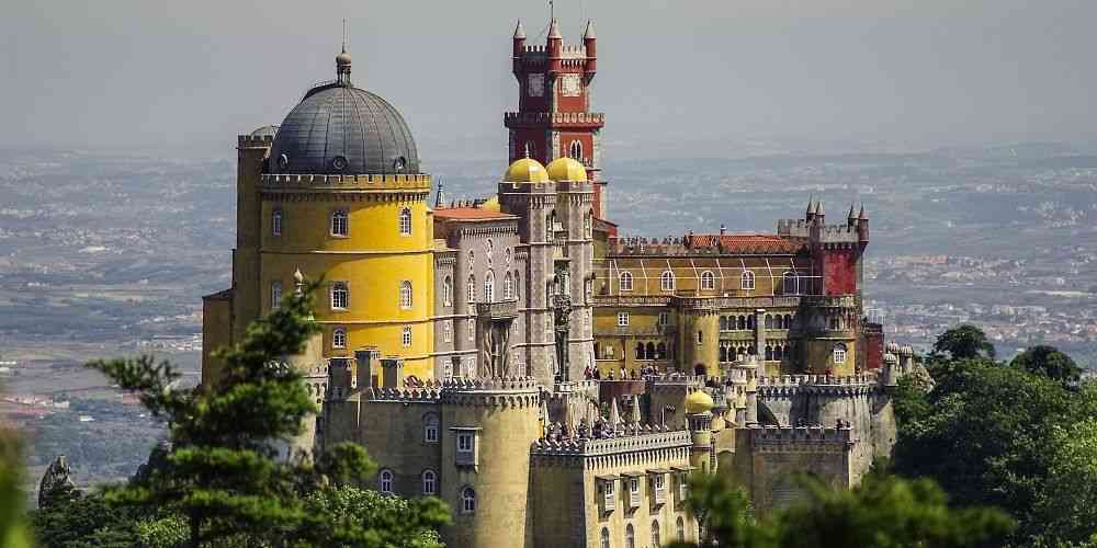 the-historic-palace-of-sintra-seen-from-above-overlooking-portugals-west-coast-plains