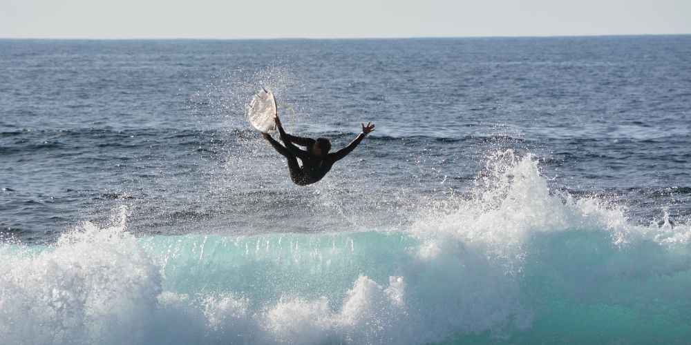 canary-islands-guide-professional-surfer-catching-waves-west-coast-lanzarote
