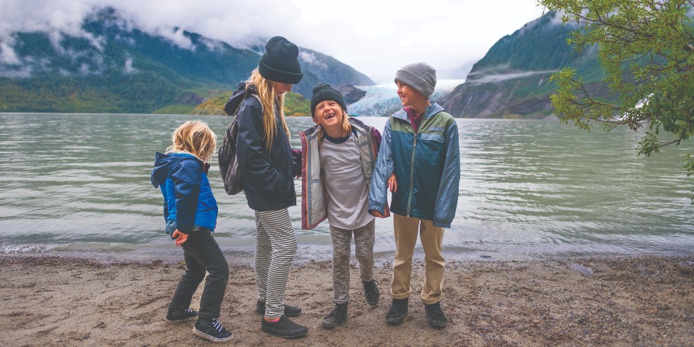 juneau-tour-alaska-royal-caribbean-cruises-kids-on-beach-against-glacier