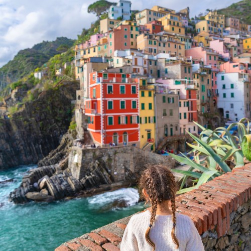 madeline-looking-over-sea-wall-at-cinque-terre-village-best-family-cruise-holidays-2022