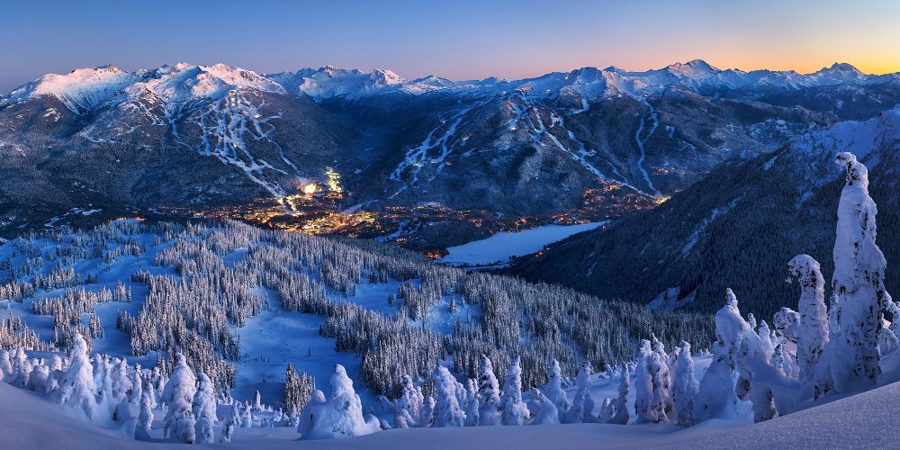sunset-whistler-village-canada-snowy-landscape-mountains-village-lights-end-of-a-family-ski-day