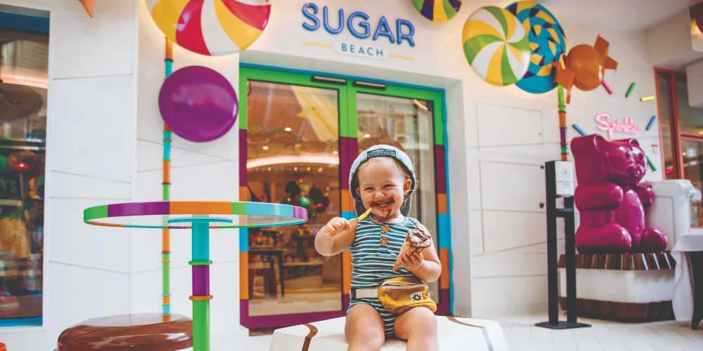 toddler-with-ice-cream-covered-face-outside-sugar-beach-concession-royal-caribbean-cruise-line