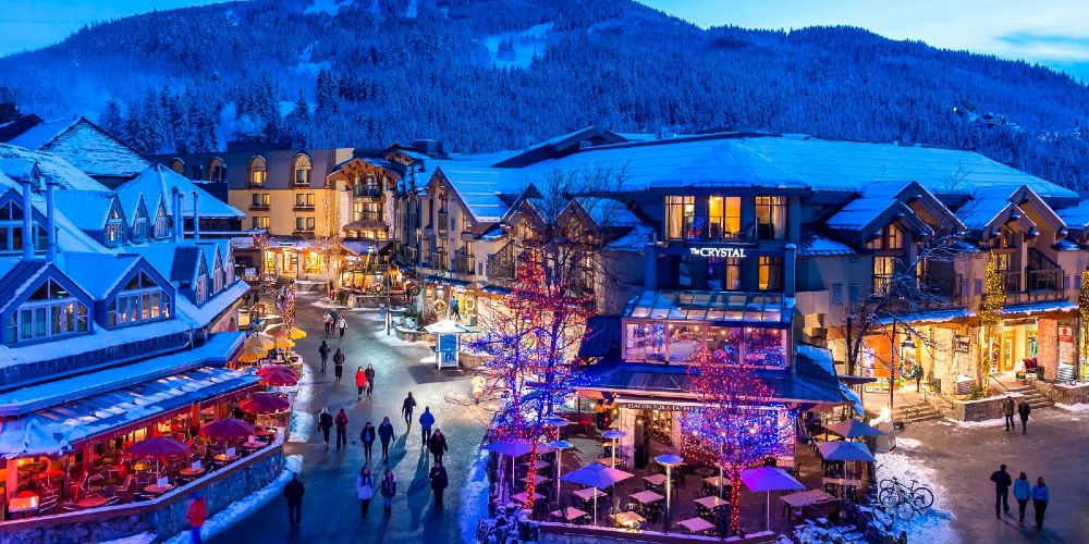 whistler-village-centre-dusk-winter-evening-street-scene-with-snowy-mountain-backdrop