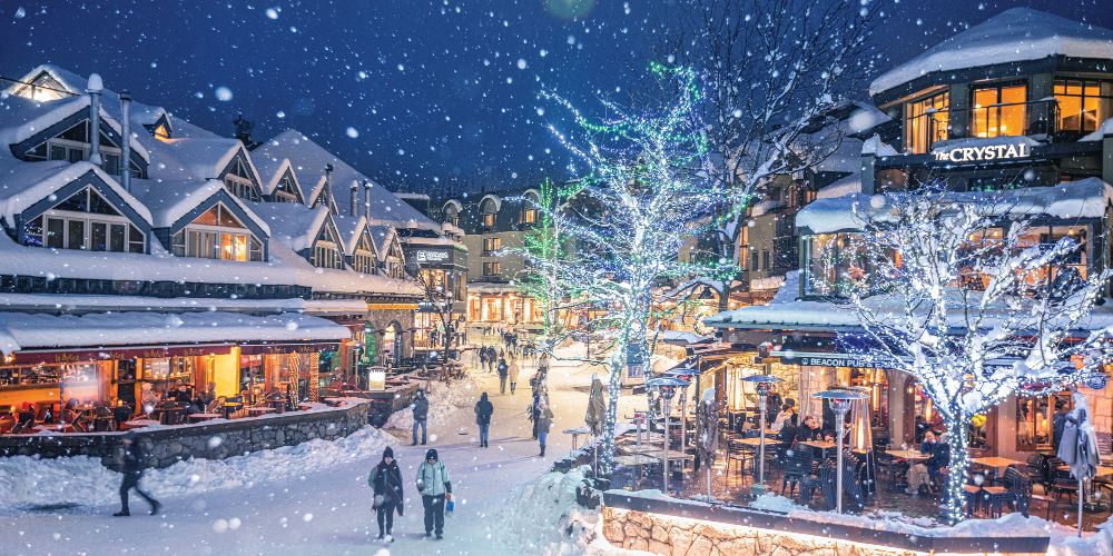 whistler-village-centre-heavy-snowfall-winter-evening-fairy-tale-lights
