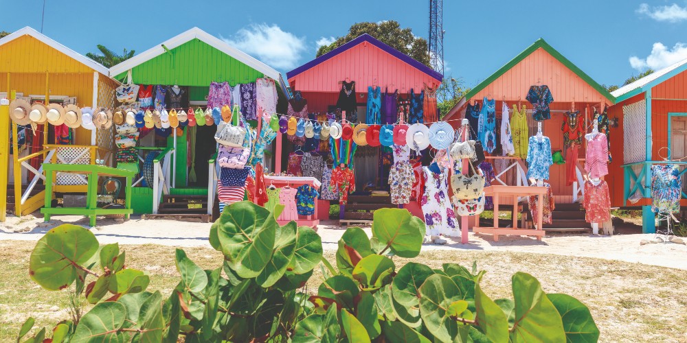 brightly-coloured-beach-hut-market-stalls-blue-skies-antigua-fun-caribbean-island-holidays