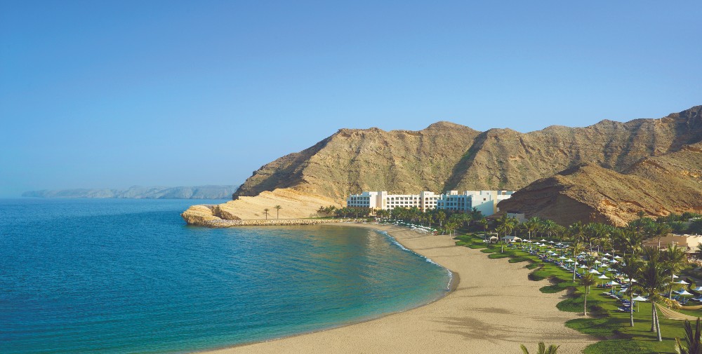 deserted-sand-beach-golden-sea-cliffs-beach-gardens-shangri-la-jissah-oman-family-holidays