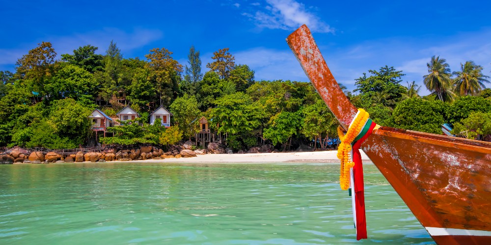 koh-lipe-thailand-beach-villas-colourful-traditional-boat