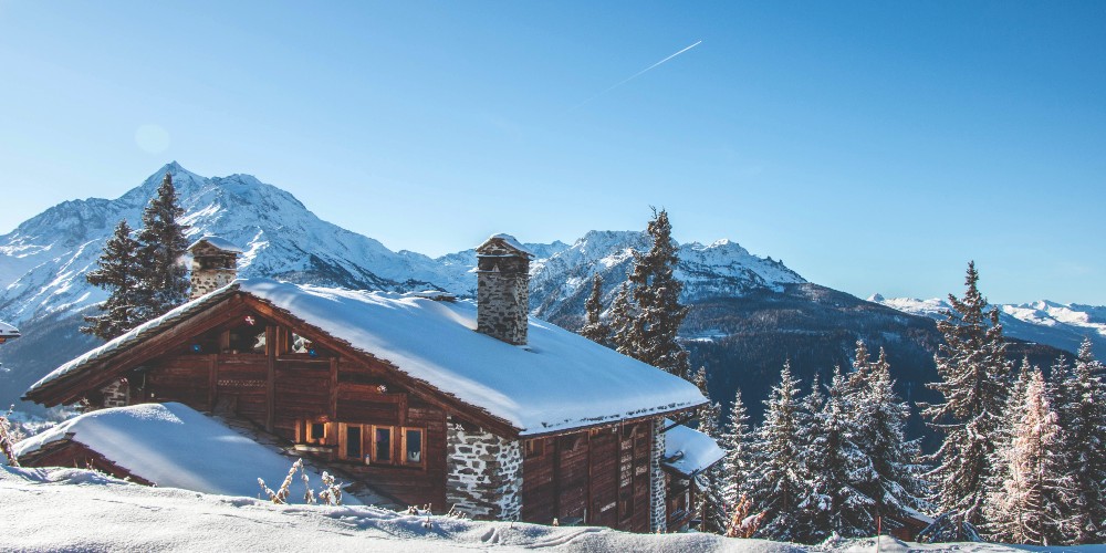 mountain-chalet-surrounded-by-snow-la-rosiere-best-family-ski-resorts-in-europe