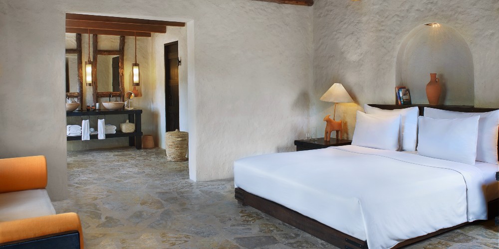 six-senses-zhigy-bay-musandan-peninsula-oman-pool-villa-bedroom-with-rustic-chic-interior-design