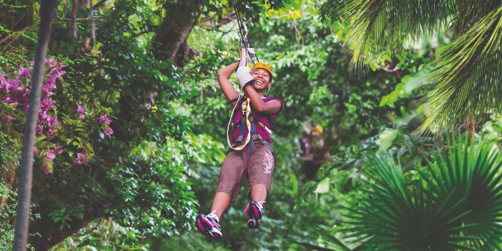 caribbean-island-rainbow-zipline-girl-on-zipline-laughing-soufriere-windjammer-resort