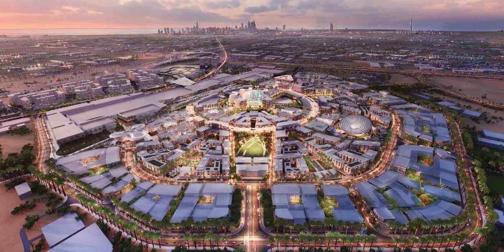 discover-expo-2020-dubai-aerial-view-of-expo-site-at-dawn-with-dubai-skyline-in-background 
