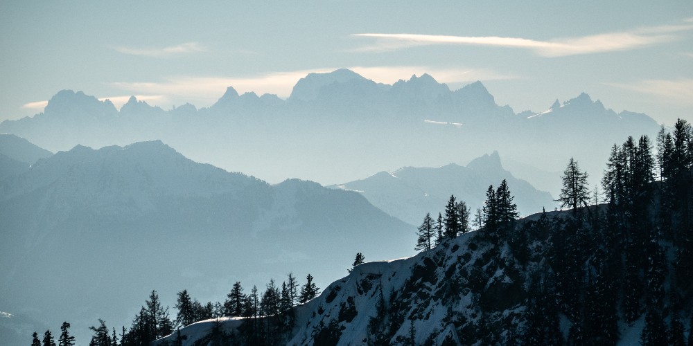 family-ski-breaks-in-switzerland-crans-montana-2019-©CMTC-Olivier-Maire-misty-aerial-view-of-mountain-ridges