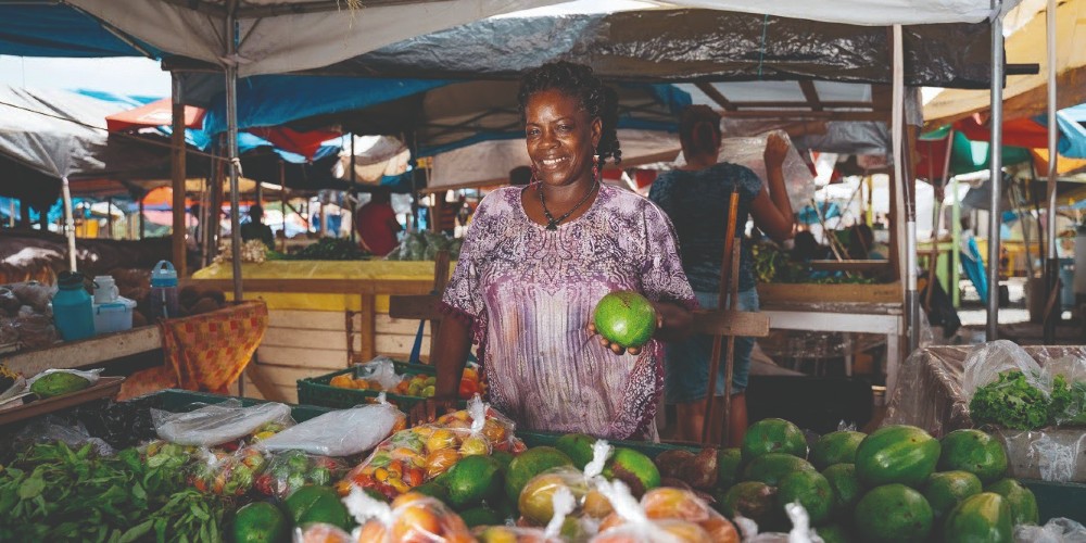 fruit-stall-with-local-stallholder-castries-market-st-lucia-family-vacations-caribbean