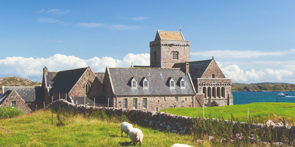 iona-abbey-sunny-day-blue-skies-fields-of-sheep-view-of-the-sound-of-iona-Hebridean-island-vacations