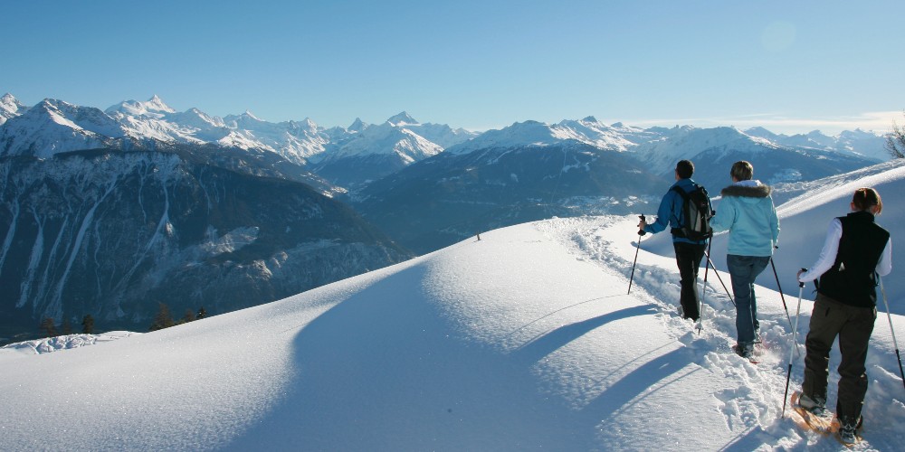 snowshoeing-high-in-mountains-family-ski-breaks-in-switzerland-Crans-montana-Deprez